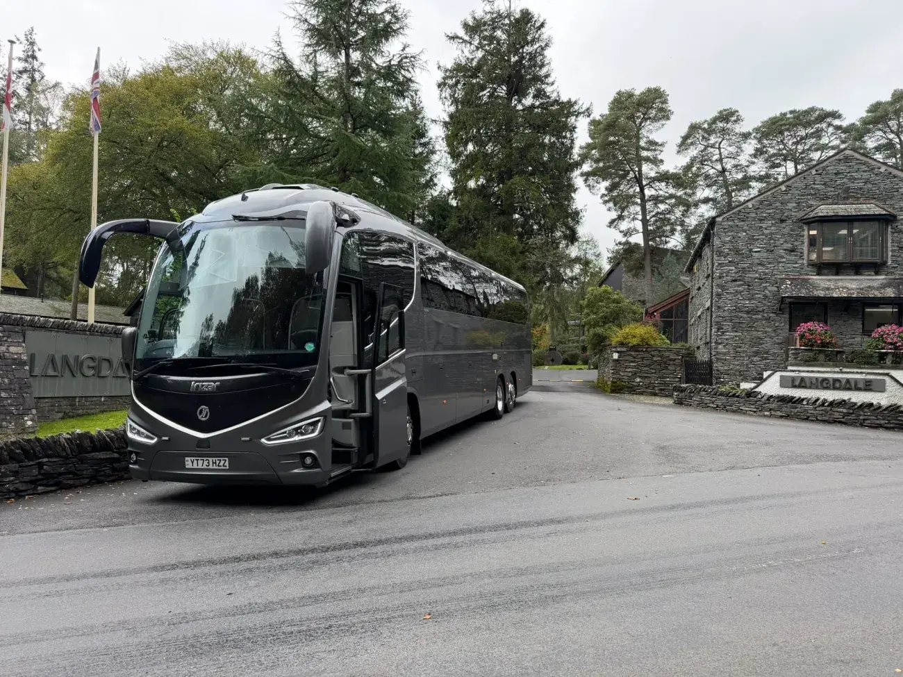 Coach outside stately home